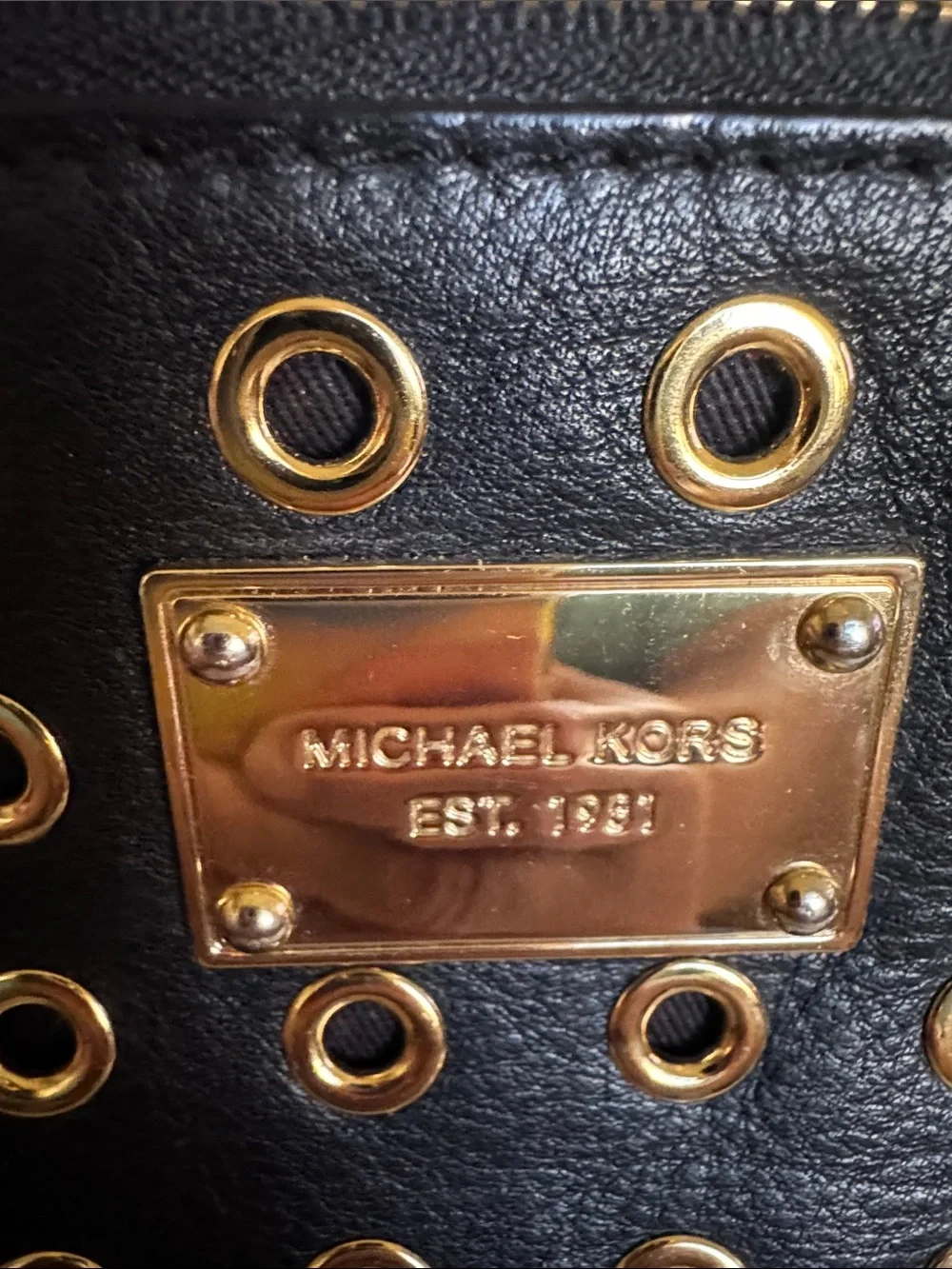 Michael Kors Black Leather Grommet Detail Wristlet with Gold Hardware